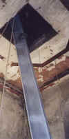 steel being hoisted inside the tower